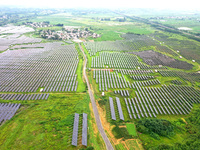 A photovoltaic power station is being shown in Ligang village, Chaohu city, East China's Anhui province, on July 9, 2024. (