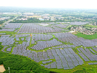 A photovoltaic power station is being shown in Ligang village, Chaohu city, East China's Anhui province, on July 9, 2024. (