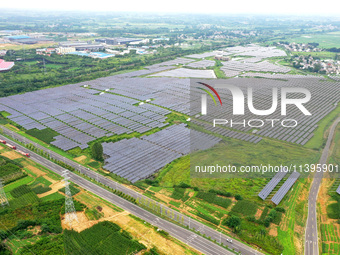 A photovoltaic power station is being shown in Ligang village, Chaohu city, East China's Anhui province, on July 9, 2024. (