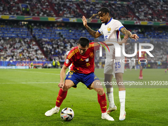 Dani Vivian centre-back of Spain and Athletic Club Bilbao and Bradley Barcola left winger of France and Paris Saint-Germain compete for the...