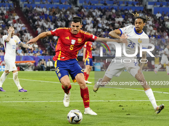 Dani Vivian centre-back of Spain and Athletic Club Bilbao and Bradley Barcola left winger of France and Paris Saint-Germain compete for the...