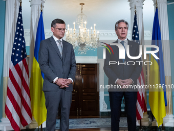 Foreign Minister Dmytro Kuleba of Ukraine (left) and Secretary of State Antony Blinken make statements to the press following a meeting at t...