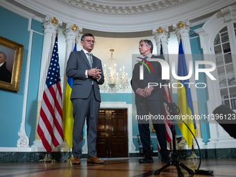 Foreign Minister Dmytro Kuleba of Ukraine (left) and Secretary of State Antony Blinken make statements to the press following a meeting at t...