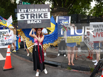 Ukrainians and supporters attend solidarity with Ukraine demonstration in front of the Washington Monument during the 75th NATO Summit in Wa...