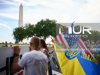 Ukrainians and supporters attend solidarity with Ukraine demonstration in front of the Washington Monument during the 75th NATO Summit in Wa...