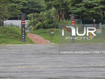 The road connecting the village is being cut off due to the flood caused by the heavy rain last night at Hoeryongpo village in Yecheon, Sout...