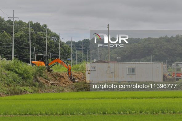 They are repairing the damaged levee that collapsed due to the heavy rain last night at Gaepo-Myeon in Yecheon, South Korea, in Sangju, Sout...