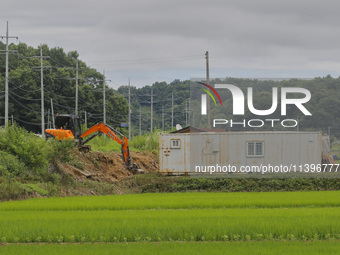 They are repairing the damaged levee that collapsed due to the heavy rain last night at Gaepo-Myeon in Yecheon, South Korea, in Sangju, Sout...