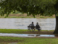 People are watching the river that is overflowing to the danger level due to the heavy rain last night at Younggang-river in Moongyeong, Sou...