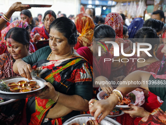 Hindu devotees are gathering beside the river Buriganga to float their lamps just after Bipodnashini Puja in Dhaka, Bangladesh, on July 09,...