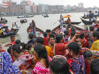 Hindu devotees are gathering beside the river Buriganga to float their lamps just after Bipodnashini Puja in Dhaka, Bangladesh, on July 09,...