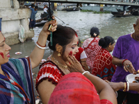 Hindu devotees are gathering beside the river Buriganga to float their lamps just after Bipodnashini Puja in Dhaka, Bangladesh, on July 09,...