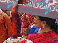 Hindu devotees are gathering beside the river Buriganga to float their lamps just after Bipodnashini Puja in Dhaka, Bangladesh, on July 09,...