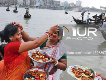 Hindu devotees are gathering beside the river Buriganga to float their lamps just after Bipodnashini Puja in Dhaka, Bangladesh, on July 09,...