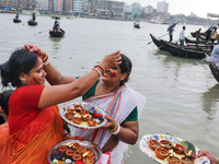 Hindu devotees are gathering beside the river Buriganga to float their lamps just after Bipodnashini Puja in Dhaka, Bangladesh, on July 09,...