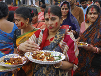 Hindu devotees are gathering beside the river Buriganga to float their lamps just after Bipodnashini Puja in Dhaka, Bangladesh, on July 09,...