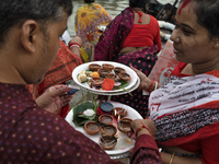 Hindu devotees are gathering beside the river Buriganga to float their lamps just after Bipodnashini Puja in Dhaka, Bangladesh, on July 09,...