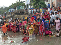 Hindu devotees are gathering beside the river Buriganga to float their lamps just after Bipodnashini Puja in Dhaka, Bangladesh, on July 09,...