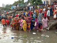 Hindu devotees are gathering beside the river Buriganga to float their lamps just after Bipodnashini Puja in Dhaka, Bangladesh, on July 09,...