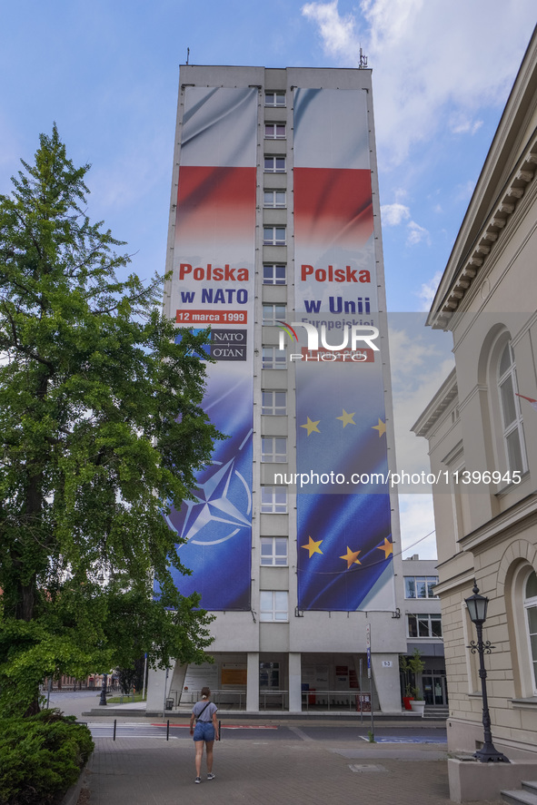 A mural celebrating Poland's anniversaries in NATO and the EU, featuring NATO and EU flags, is being seen in Bydgoszcz, Poland, on May 30, 2...