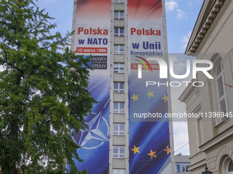 A mural celebrating Poland's anniversaries in NATO and the EU, featuring NATO and EU flags, is being seen in Bydgoszcz, Poland, on May 30, 2...