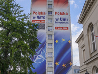 A mural celebrating Poland's anniversaries in NATO and the EU, featuring NATO and EU flags, is being seen in Bydgoszcz, Poland, on May 30, 2...