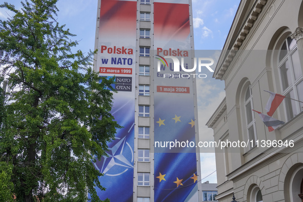 A mural celebrating Poland's anniversaries in NATO and the EU, featuring NATO and EU flags, is being seen in Bydgoszcz, Poland, on May 30, 2...