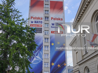 A mural celebrating Poland's anniversaries in NATO and the EU, featuring NATO and EU flags, is being seen in Bydgoszcz, Poland, on May 30, 2...