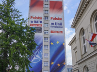 A mural celebrating Poland's anniversaries in NATO and the EU, featuring NATO and EU flags, is being seen in Bydgoszcz, Poland, on May 30, 2...