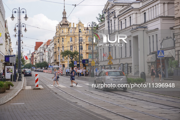 A general view of Gdanska Street with people crossing the pedestrian crossing is being seen in Bydgoszcz, Poland, on May 30, 2024 