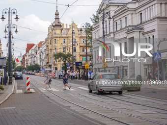 A general view of Gdanska Street with people crossing the pedestrian crossing is being seen in Bydgoszcz, Poland, on May 30, 2024 (