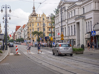 A general view of Gdanska Street with people crossing the pedestrian crossing is being seen in Bydgoszcz, Poland, on May 30, 2024 (