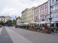 A general view of the old town street with open-air restaurants is being seen in Bydgoszcz, Poland, on May 30, 2024. (