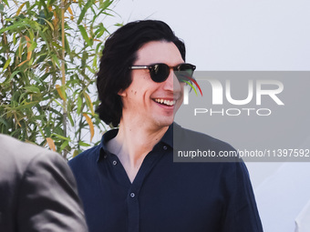 Adam Driver is arriving at the photocall of Megalopolis during the 77th Festival de Cannes in Cannes, France, on May 17, 2024 (