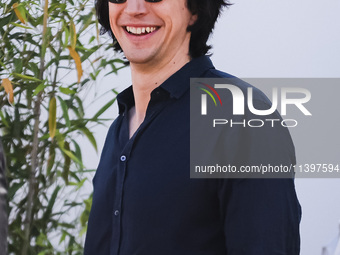 Adam Driver is arriving at the photocall of Megalopolis during the 77th Festival de Cannes in Cannes, France, on May 17, 2024 (