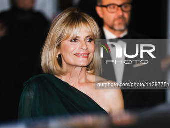 Isabella Ferrari is leaving the hotel for the red carpet of Parthenope during the 77th Festival de Cannes in Cannes, France, on May 21, 2024...