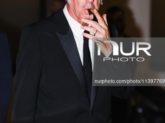 Paolo Sorrentino is leaving the hotel for the red carpet of Parthenope during the 77th Festival de Cannes in Cannes, France, on May 21, 2024...