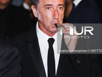 Paolo Sorrentino is leaving the hotel for the red carpet of Parthenope during the 77th Festival de Cannes in Cannes, France, on May 21, 2024...