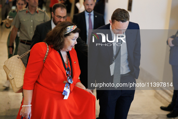 Karen Pierce, British Ambassador to the United States, left in red, departs a meeting between a bipartisan group of U.S. Senators and leader...