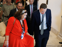 Karen Pierce, British Ambassador to the United States, left in red, departs a meeting between a bipartisan group of U.S. Senators and leader...