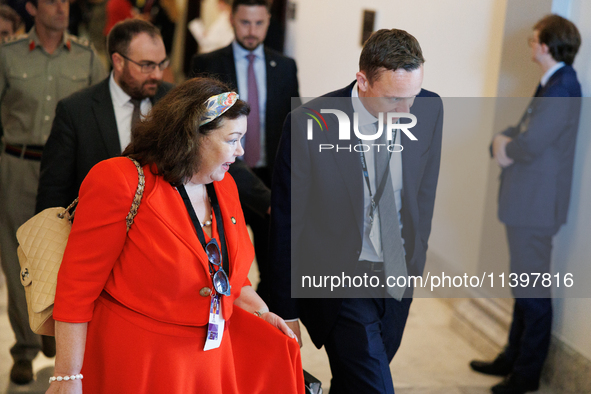 Karen Pierce, British Ambassador to the United States, left in red, departs a meeting between a bipartisan group of U.S. Senators and leader...