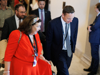 Karen Pierce, British Ambassador to the United States, left in red, departs a meeting between a bipartisan group of U.S. Senators and leader...