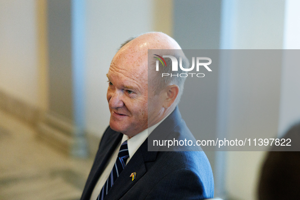 U.S. Senator Chris Coons (D-DE) departs a meeting between a bipartisan group of U.S. Senators and leaders from NATO on Capitol Hill in Washi...