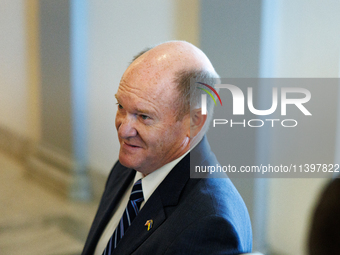 U.S. Senator Chris Coons (D-DE) departs a meeting between a bipartisan group of U.S. Senators and leaders from NATO on Capitol Hill in Washi...