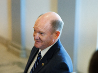 U.S. Senator Chris Coons (D-DE) departs a meeting between a bipartisan group of U.S. Senators and leaders from NATO on Capitol Hill in Washi...