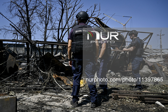 Rescue workers are dealing with the damage from the July 8 Russian missile attack in Vilniansk, Zaporizhzhia region, southeastern Ukraine, o...