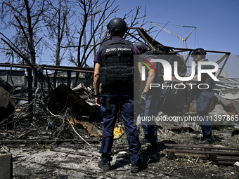 Rescue workers are dealing with the damage from the July 8 Russian missile attack in Vilniansk, Zaporizhzhia region, southeastern Ukraine, o...