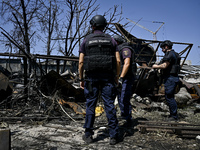 Rescue workers are dealing with the damage from the July 8 Russian missile attack in Vilniansk, Zaporizhzhia region, southeastern Ukraine, o...