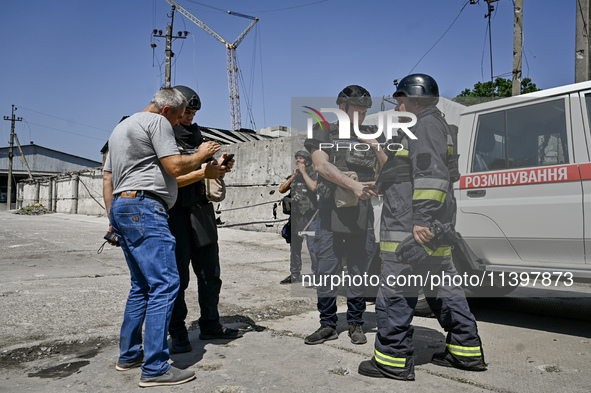 Rescue workers are dealing with the damage from the July 8 Russian missile attack in Vilniansk, Zaporizhzhia region, southeastern Ukraine, o...