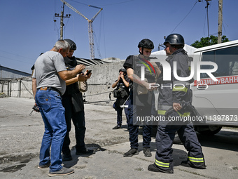 Rescue workers are dealing with the damage from the July 8 Russian missile attack in Vilniansk, Zaporizhzhia region, southeastern Ukraine, o...